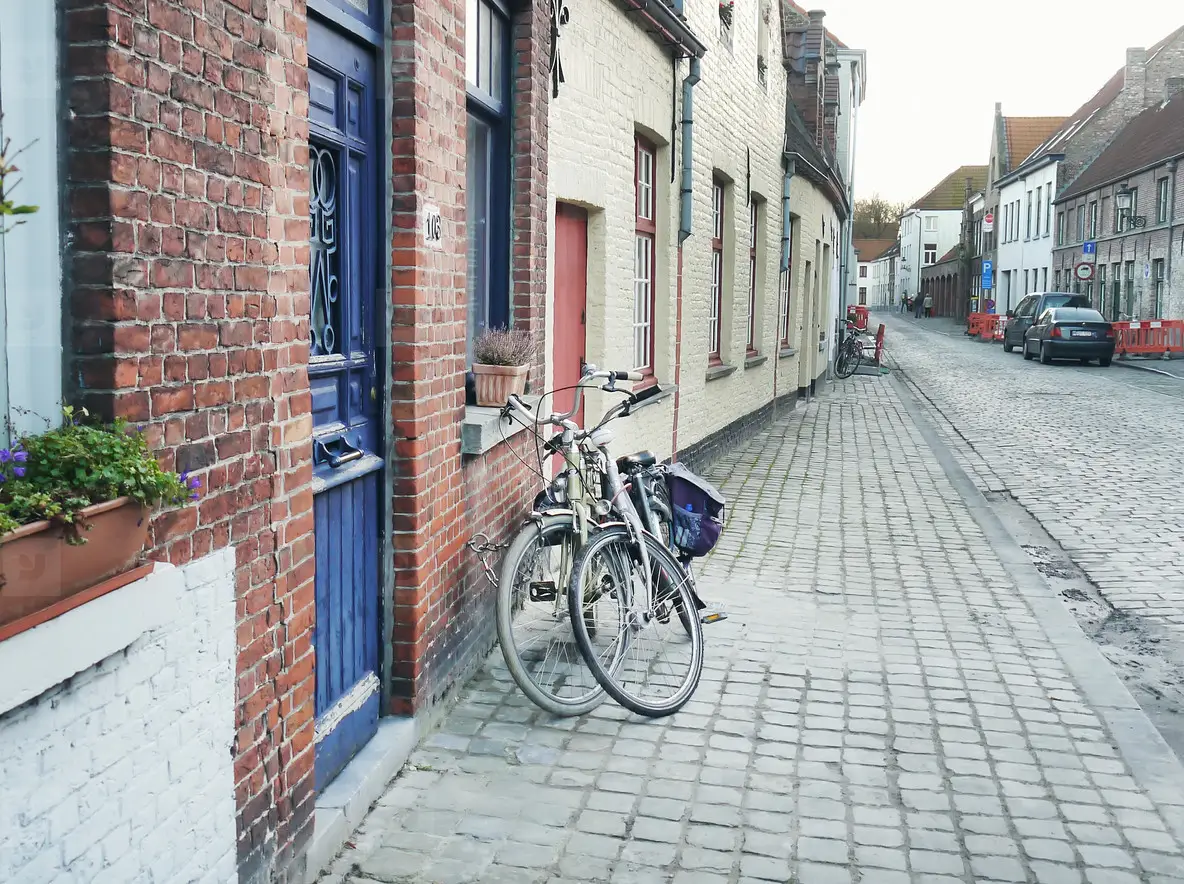 Medieval Empty Side Street Of Bruges, Belgium, With A Bike Parke Photo ...