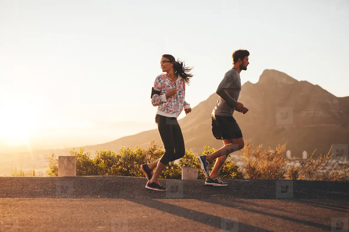 Young Couple Jogging On Country Road Photo (122108) YouWorkForThem