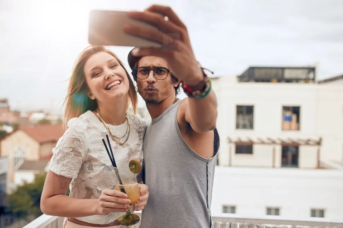 Friends Taking A Selfie On Rooftop Party Photo (123643) - YouWorkForThem