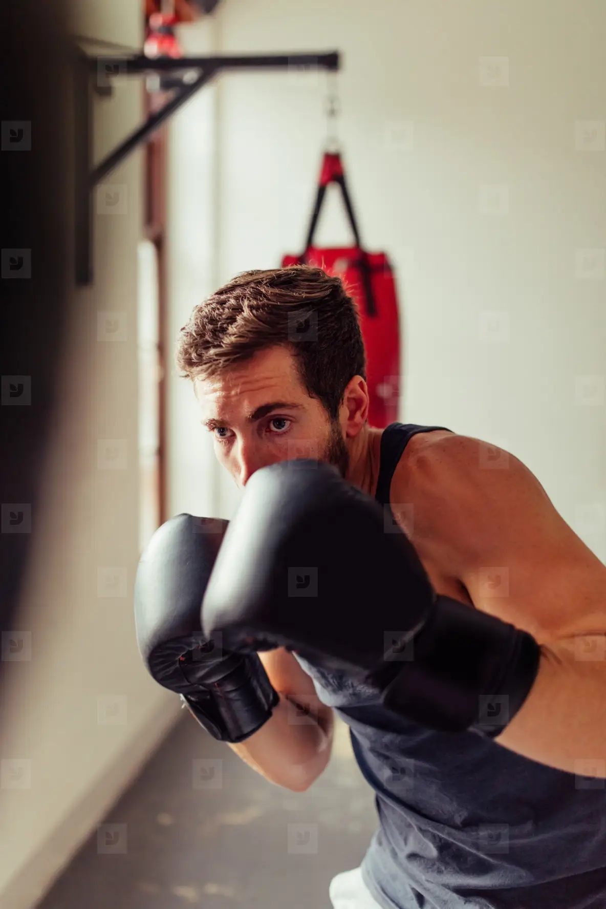 Solitary fighter wearing gloves and black shirt