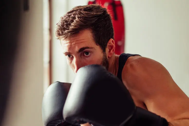 Solitary fighter wearing gloves and black shirt