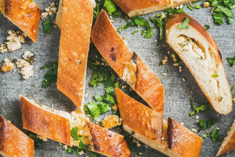 Slices of chopped turkish pizza pide with cheese and spinach