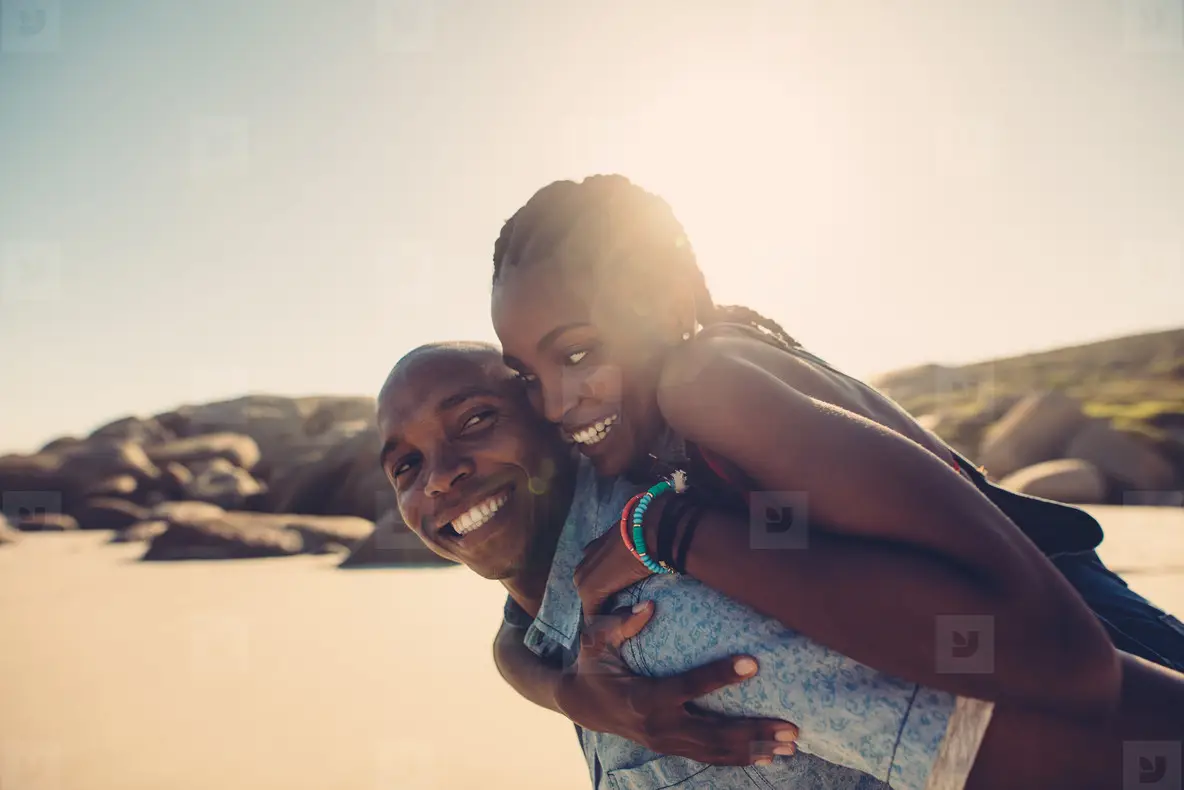 Young African Couple Enjoying At The Beach Photo (130094) - YouWorkForThem