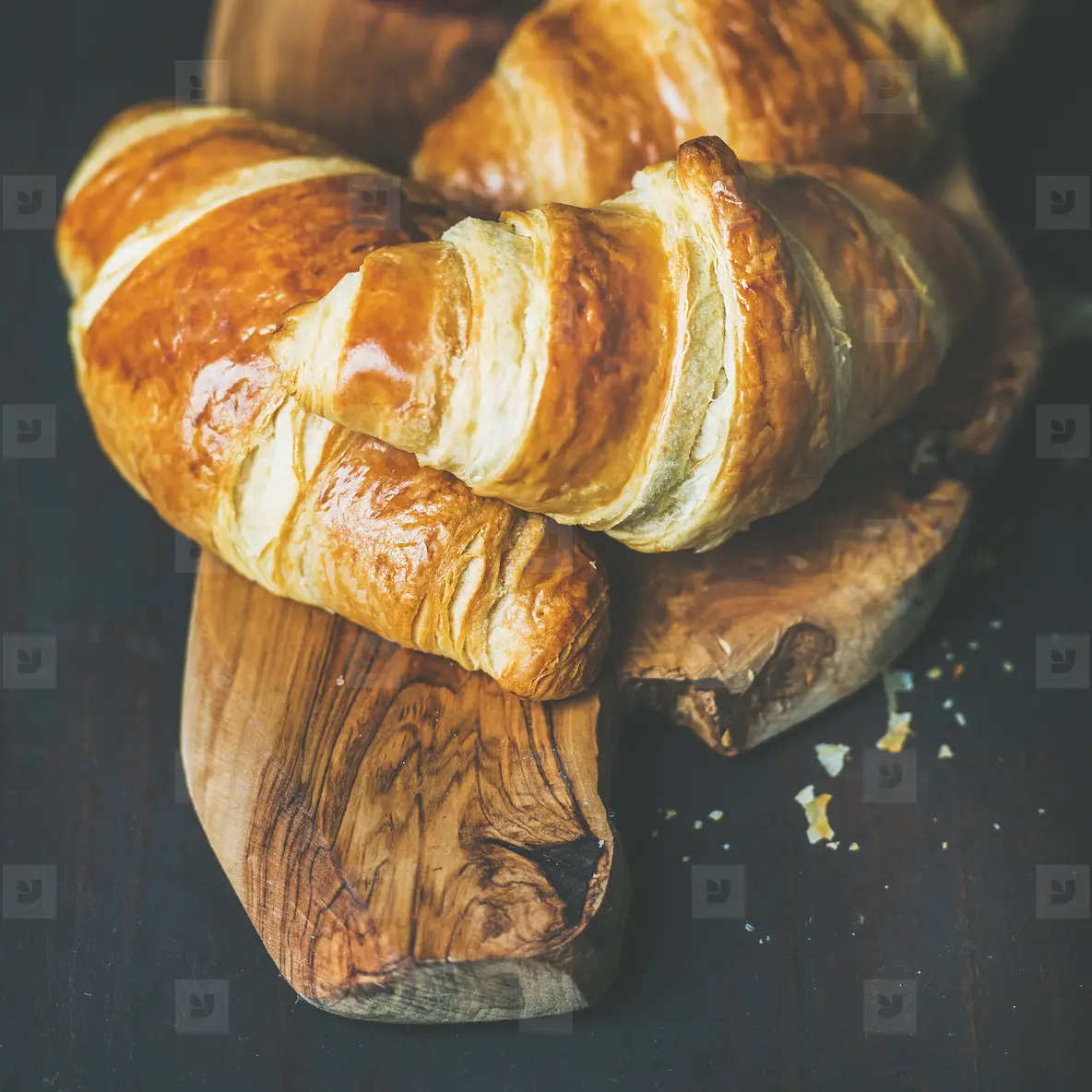 Freshly baked croissants with raspberry jam in jar  square crop
