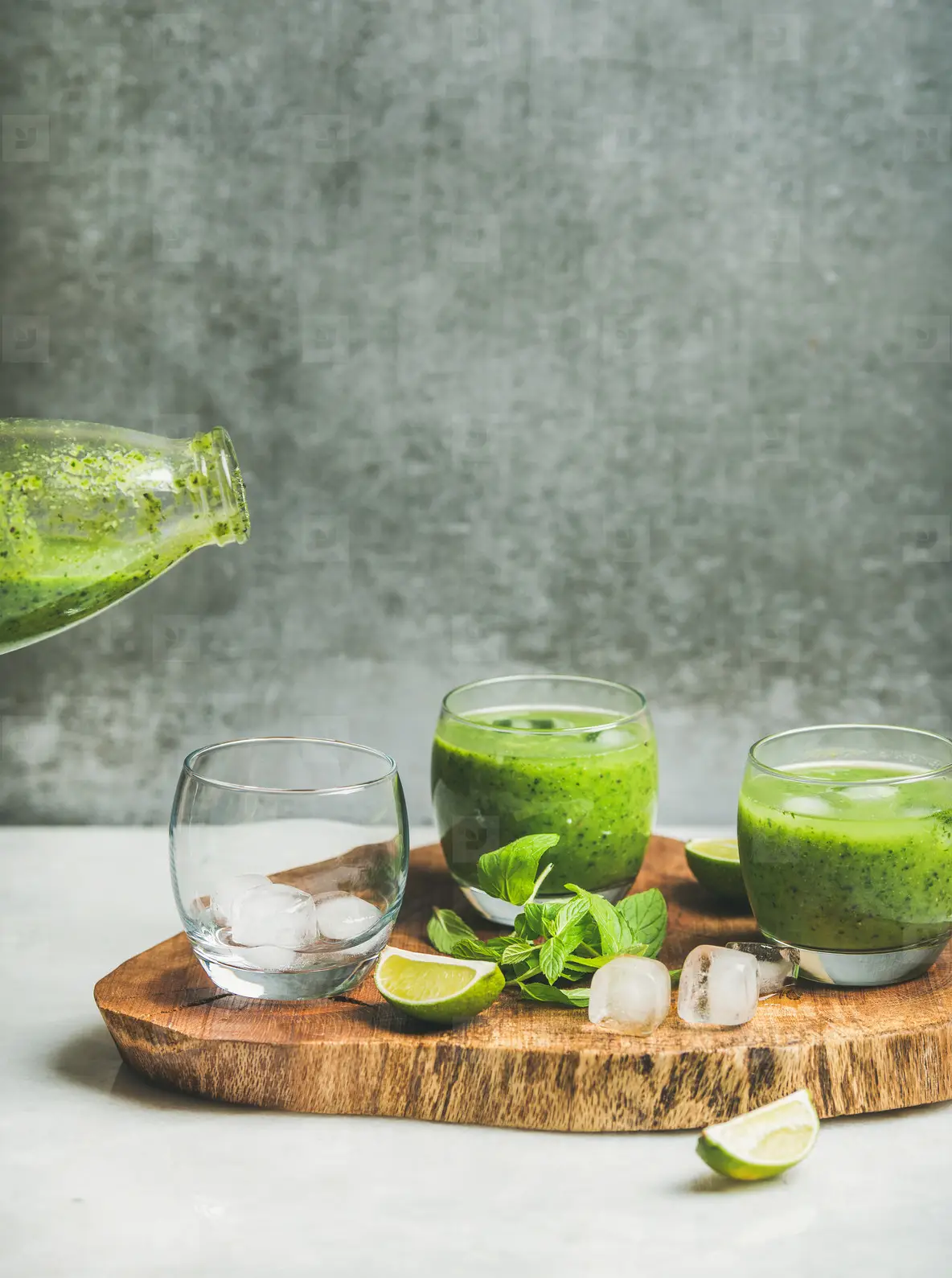Fresh green smoothie with ice  mint and lime in glasses