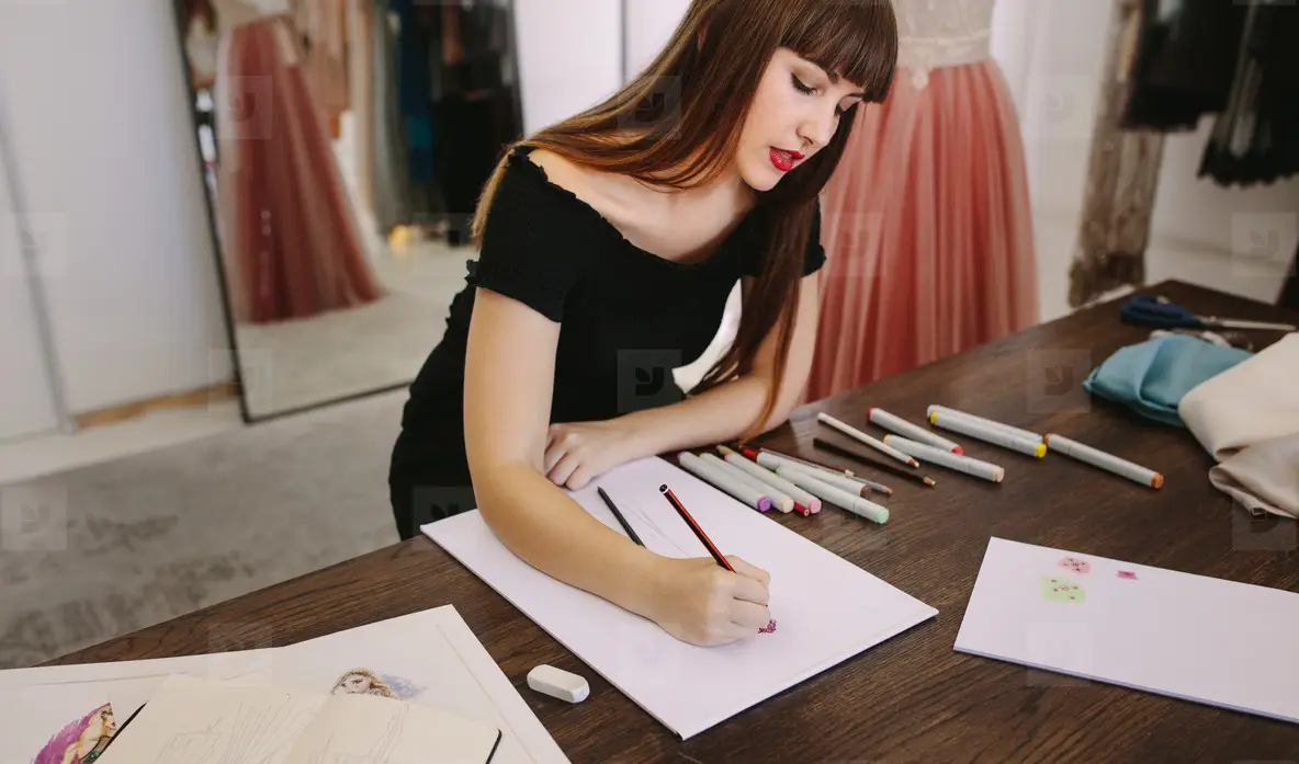 Fashion Designer Working On Her Designs In Her Studio Photo (140785 ...