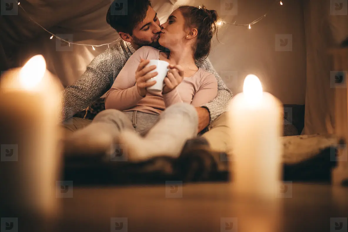 Romantic couple kissing, highlighting the role of physical affection in lasting attraction.