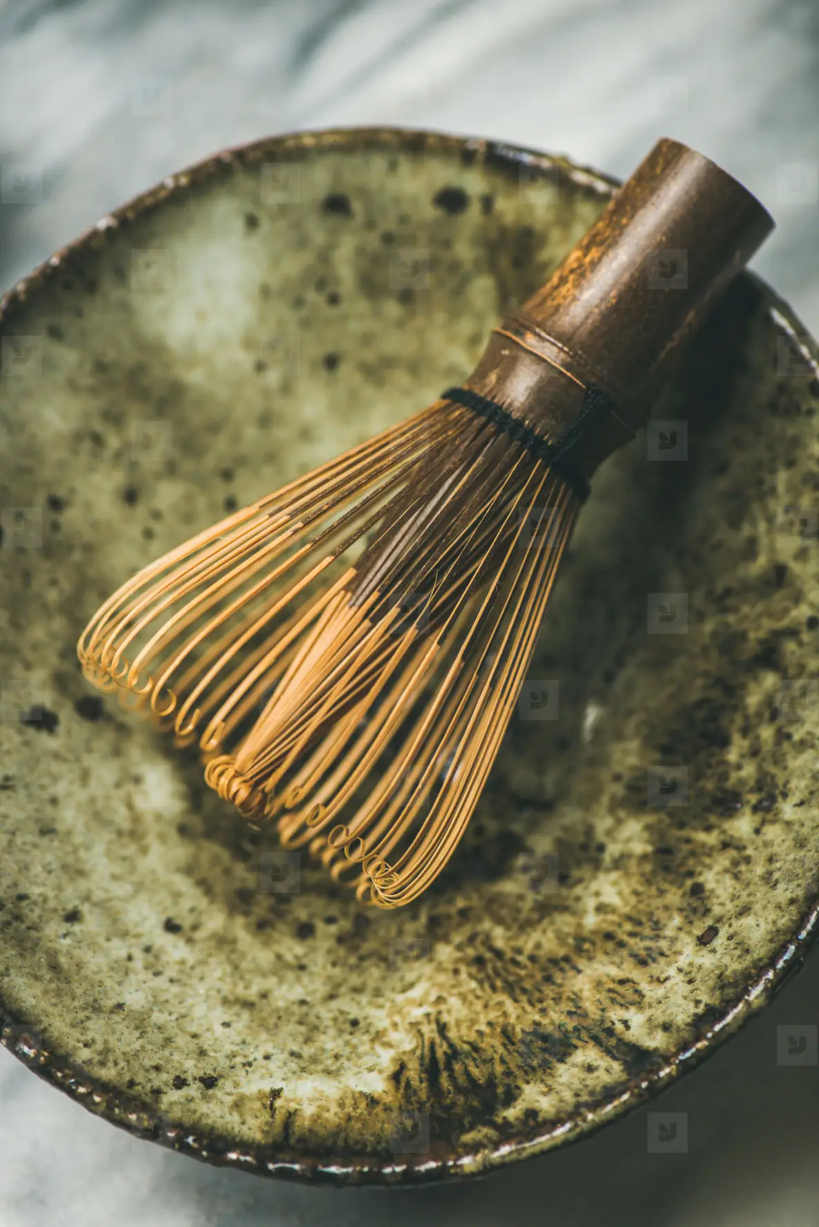Chasen bamboo whisk  Chawan bowl over grey background
