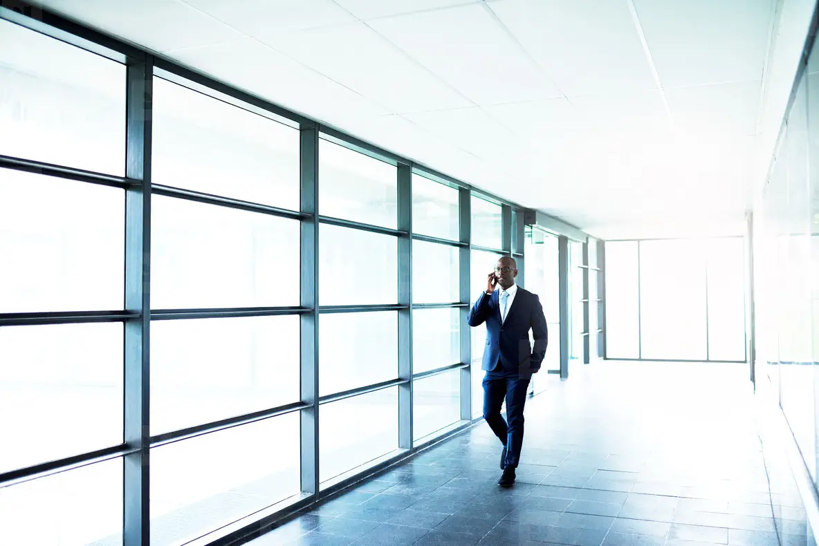 Business on Phone While Walking Inside a Building