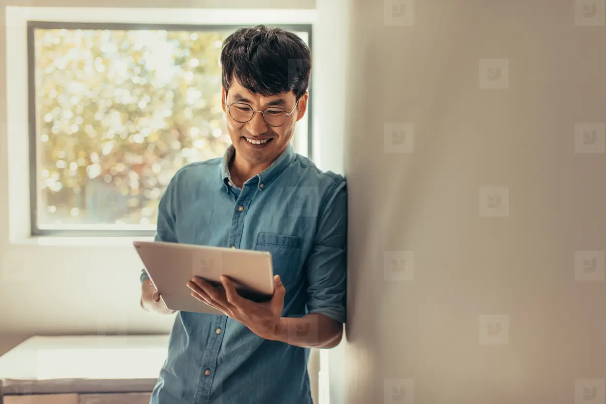Man at home updating his social media status