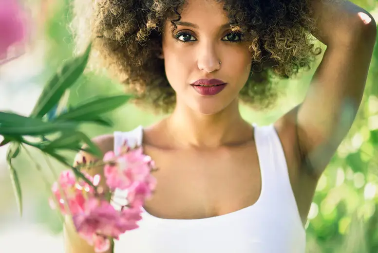 Young Black Woman With Afro Hairstyle Smiling In Urban Park Photo ...
