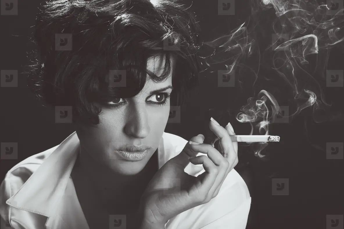 Elegant Brunette Woman Smoking A Cigarette On Black Background Photo  (181156)