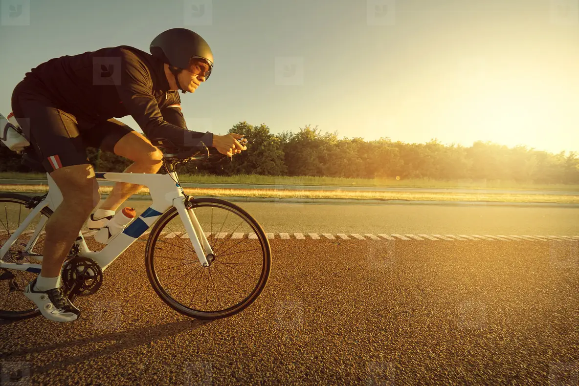 Person riding a bicycle on empty highway
