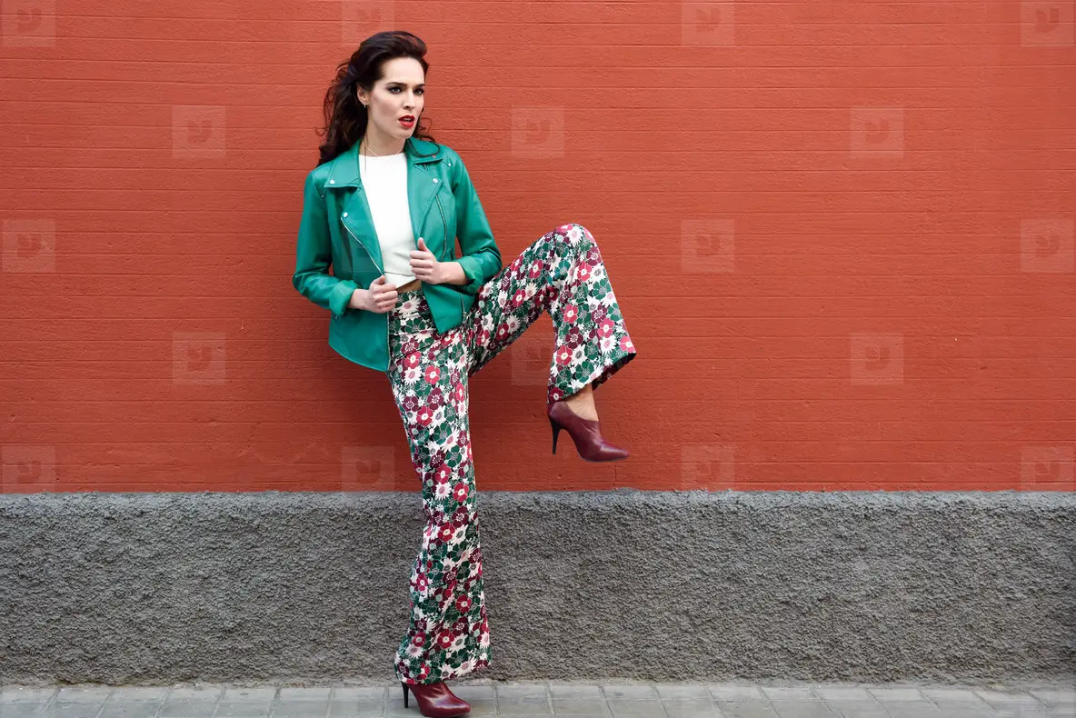 Young brunette woman smiling in urban background
