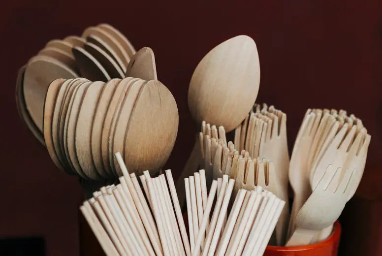 Bamboo fork, spoon and chopstick utensils in crocks