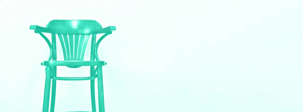 Wooden chair on light wall background with copy space for your text  Trendy green and turquoise color  Style minimalistic concept in mint color  Interior design  Banner