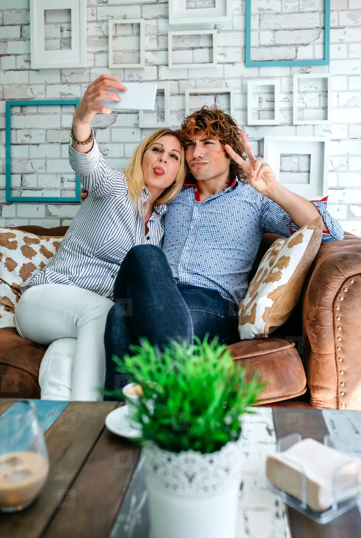 Couple Taking Selfie On A Sofa Photo (194136) - YouWorkForThem