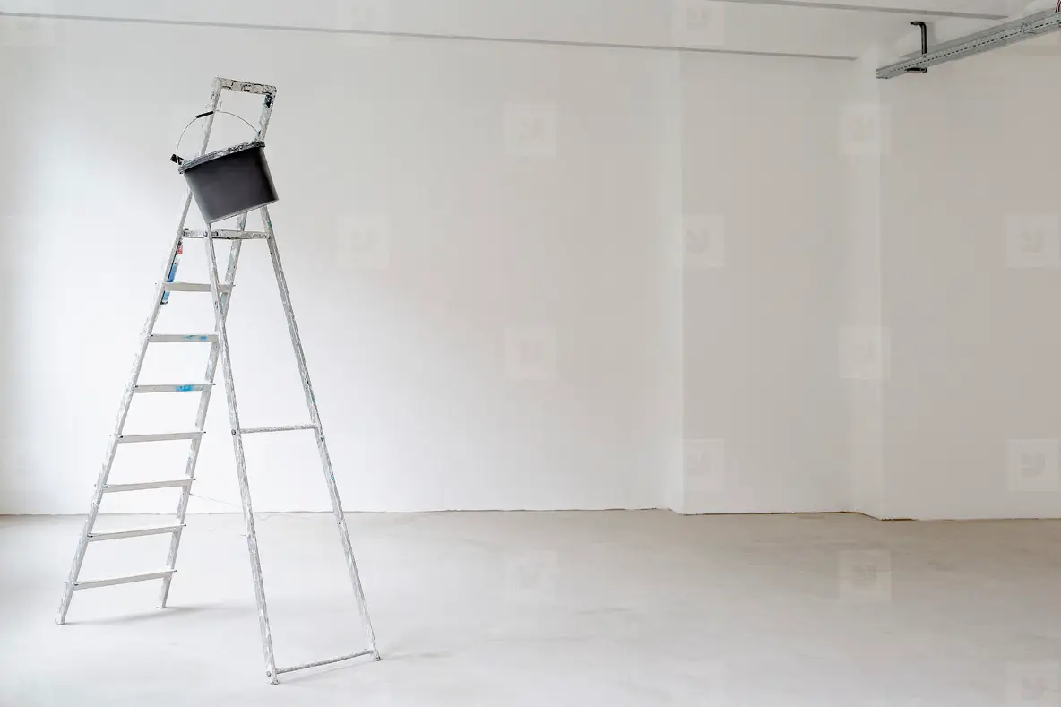 Ladder in empty room at construction site