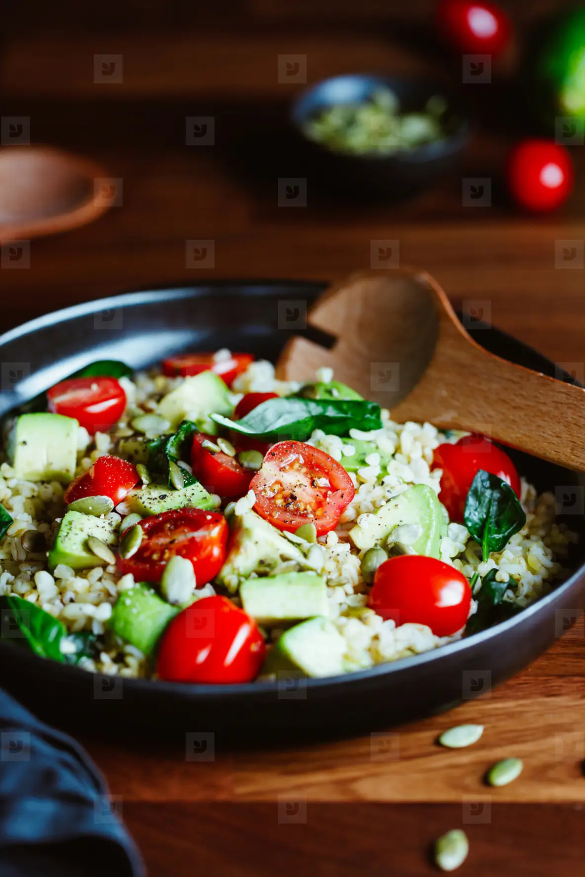 Healthy salad with bulgur  avocado  spinach and cherry tomatoes