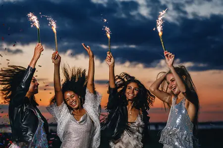 Four happy female friends