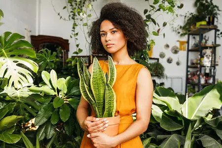 Beautiful woman holding a pot