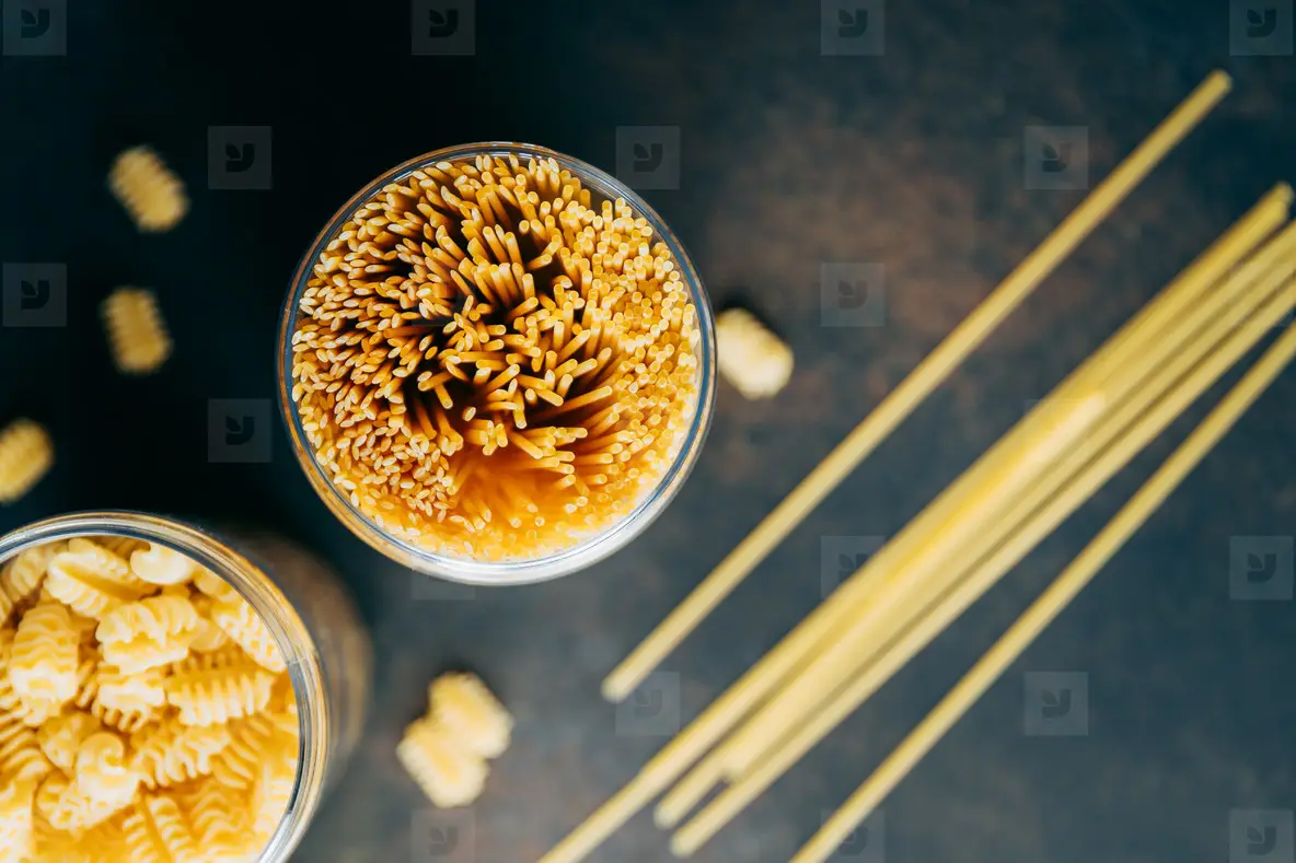 Various pasta  in a plastic jars for a long storage