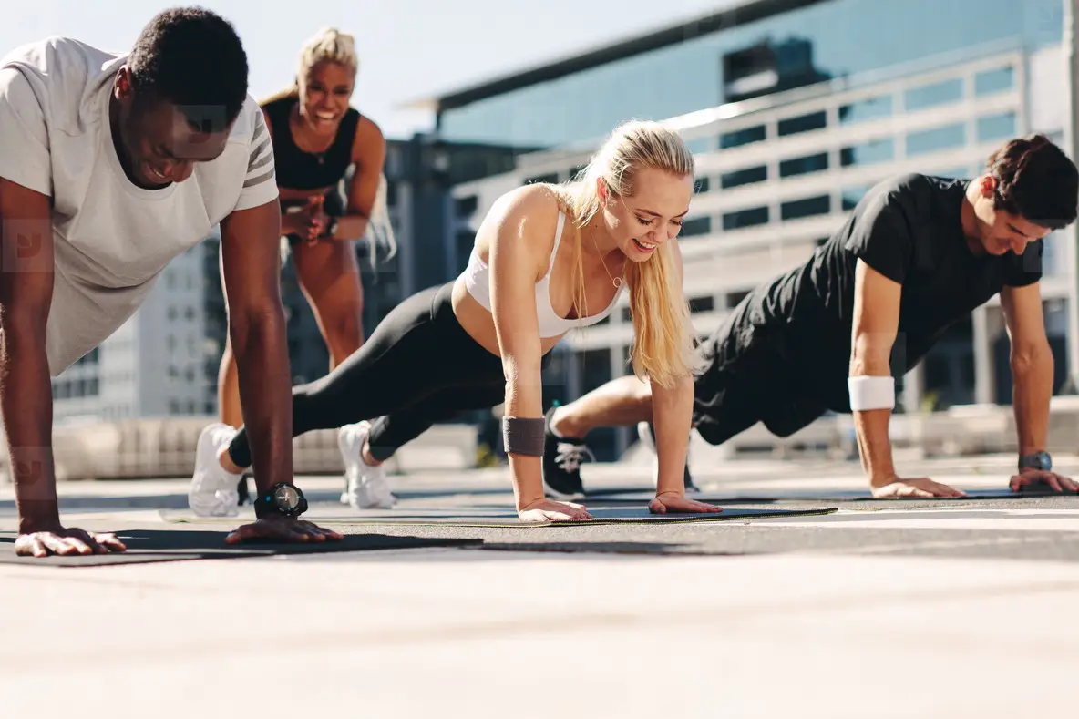 Group Of People Doing Push Ups Outdoors Photo (213554