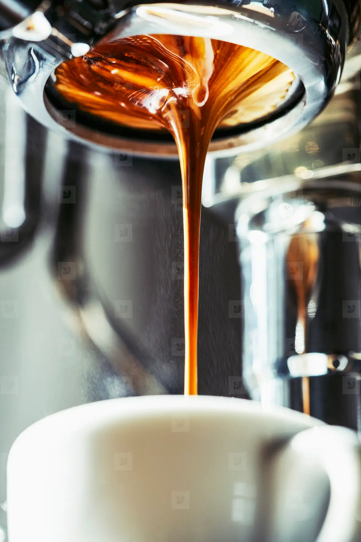 Close Up Espresso Dripping Into Coffee Cup Photo (218322