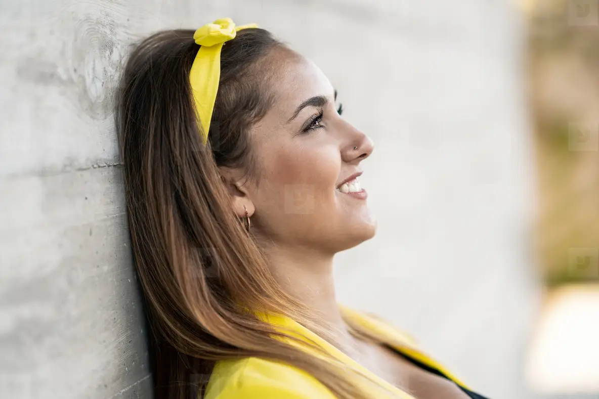 Young Woman Wearing A Yellow Jacket And Headband Smiling Photo (218630 ...