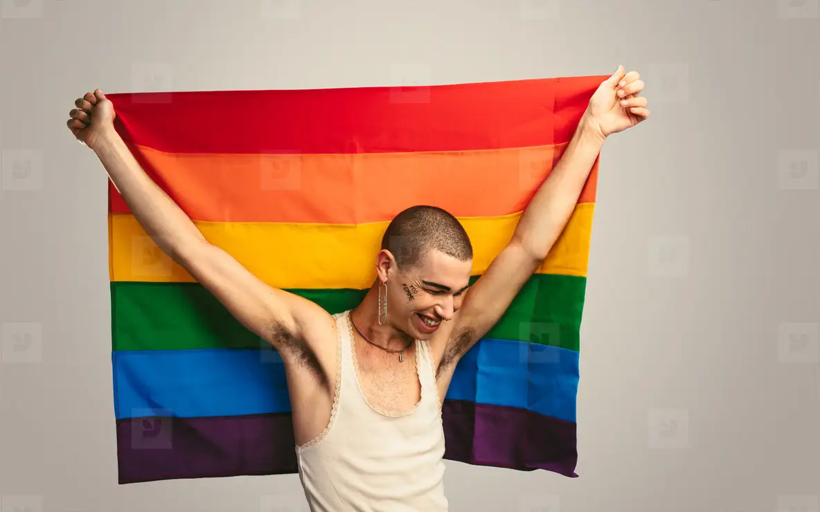 Gay Man Smiling With A Lgbt Flag Photo (219041) - YouWorkForThem