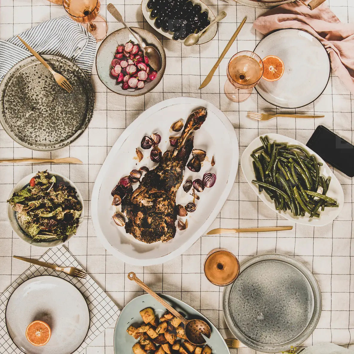 Flat lay of meat  salads  snacks and blooming mimosa  square crop