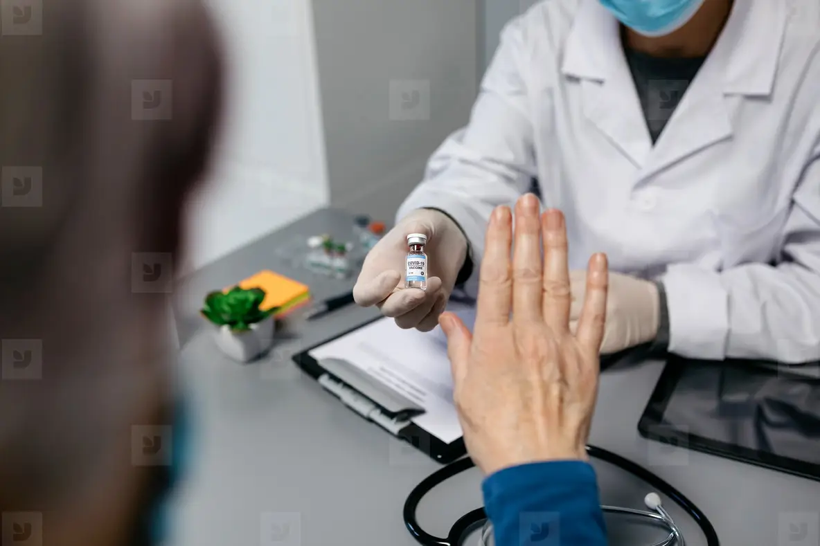 Patient Refusing The Coronavirus Vaccine Offered By Doctor Photo ...