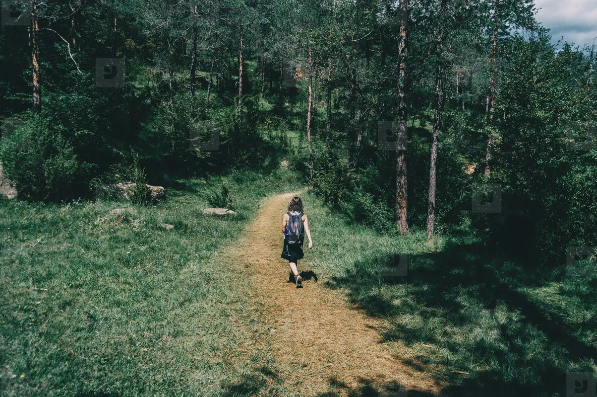 Woman Walking Along A Small Path Photo (226693) - YouWorkForThem