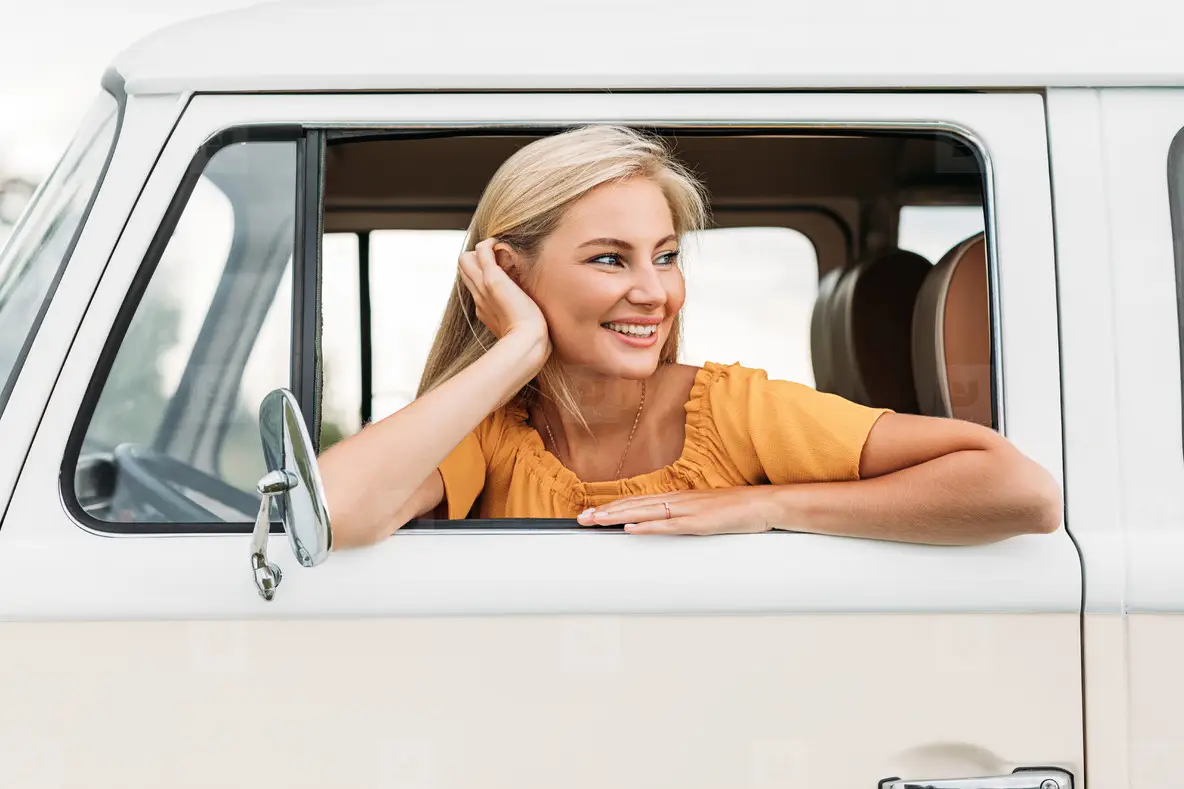 Beautiful Young Woman Looking Out Of The Car Enjoying A Great Time ...