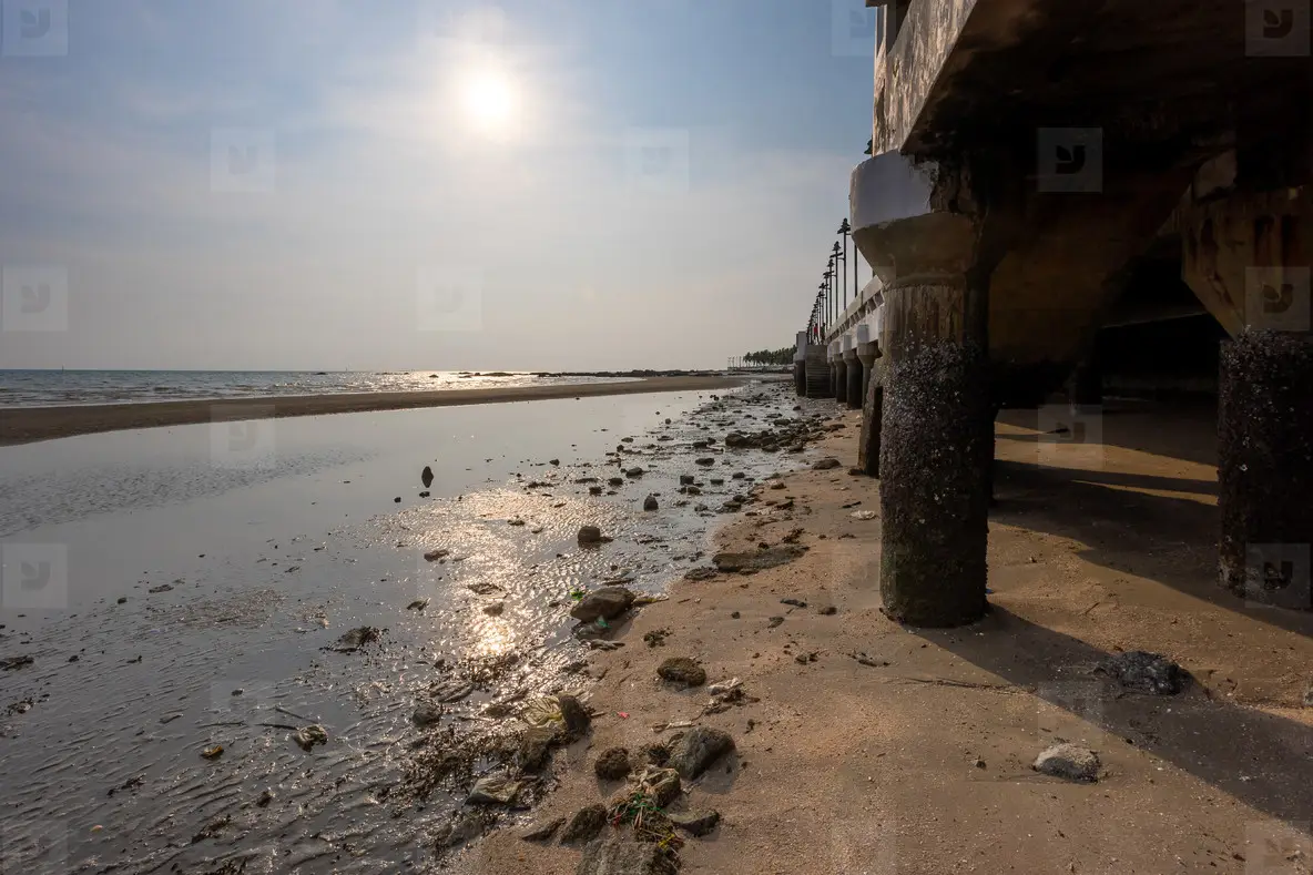 Under the walkway of Bangsaen Beach in the evening time  very fe