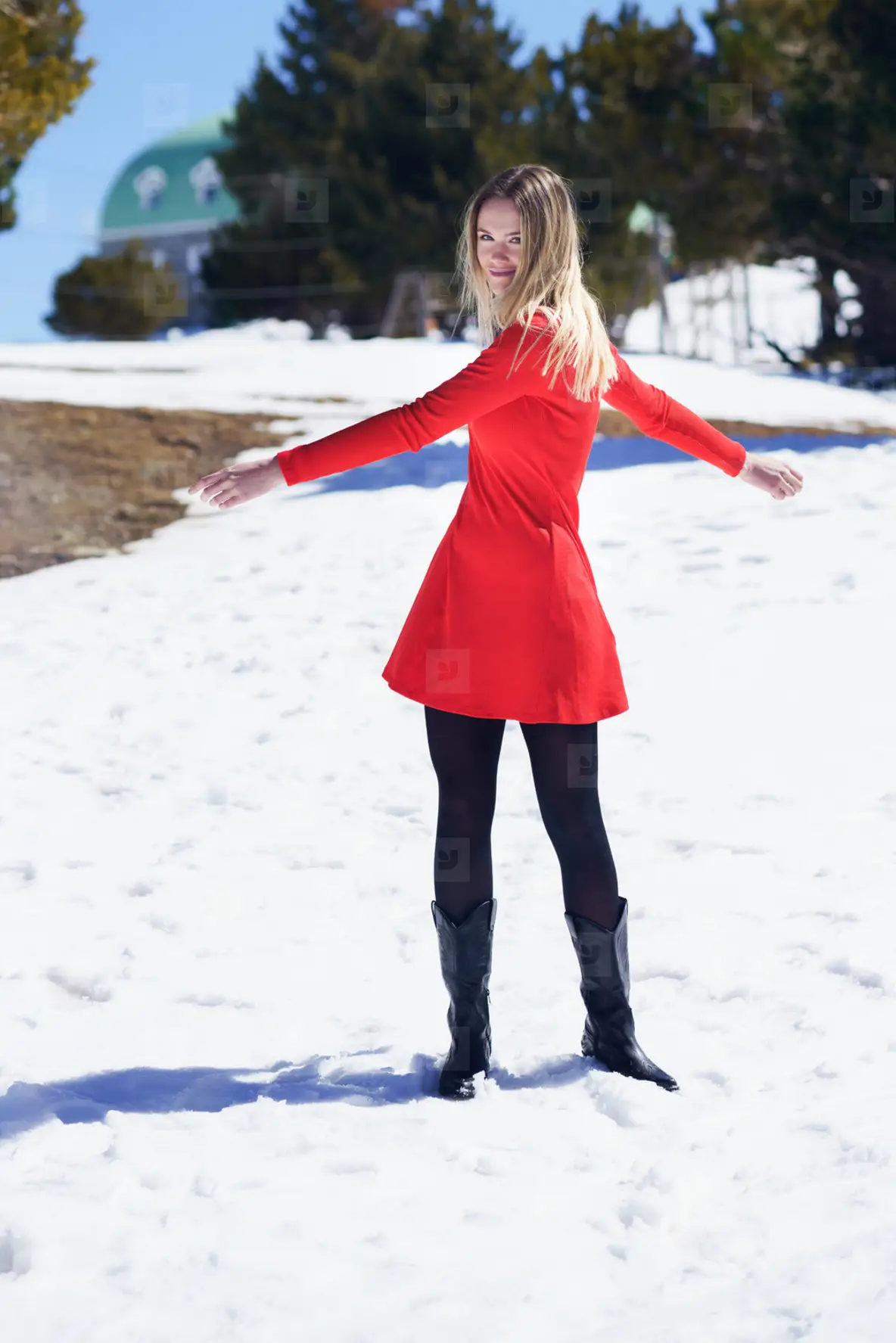Woman Wearing A Red Dress And Black Stockings Opening Her Arms In Happiness  In The Snowy Mountains Photo (239488)