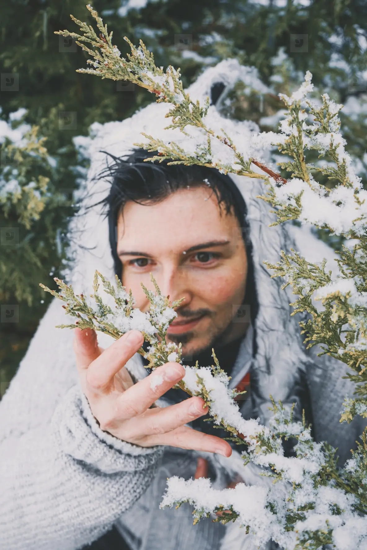 Young man enjoying a snowy day in a forest