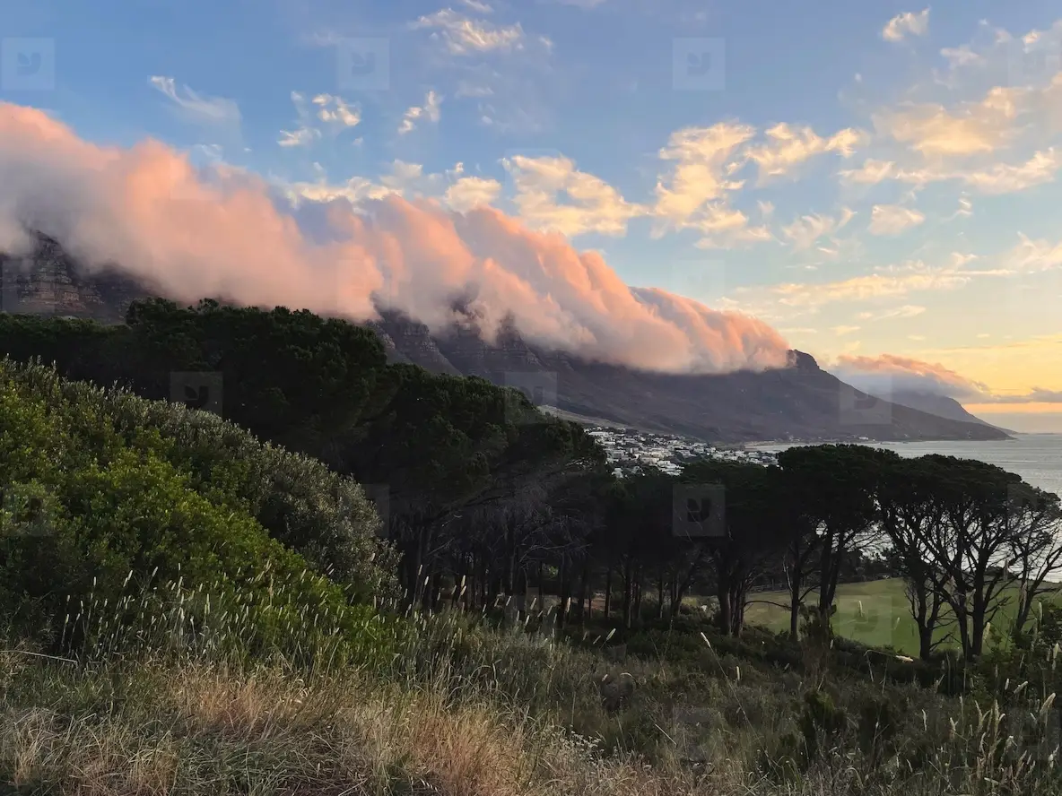 Beautiful scene of the mountains with clouds at sunset