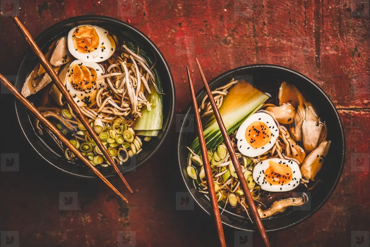 Japanese Ramen soup with chicken and shiitake mushrooms in bowls