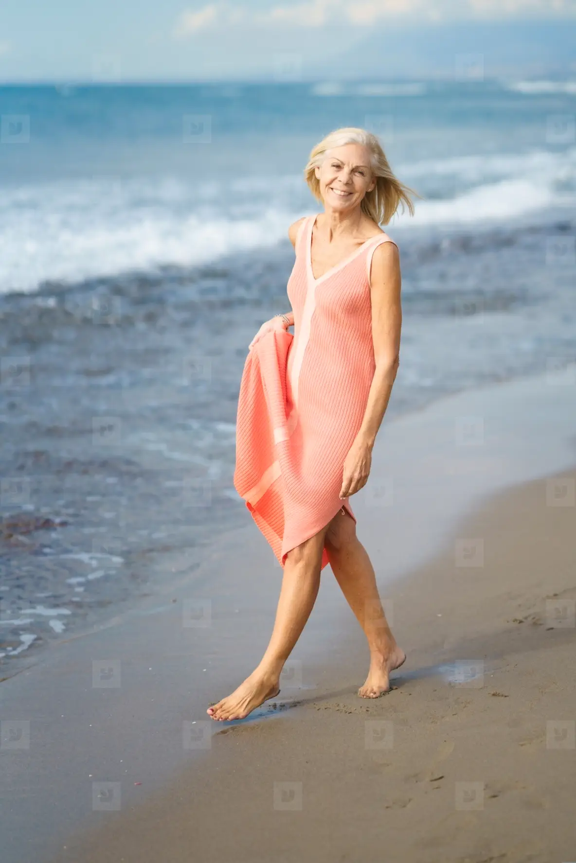 Mature Woman On Shore Of A Beach. Elderly Female Enjoying Her Retirement At  A Seaside Retreat Photo (254568) - YouWorkForThem