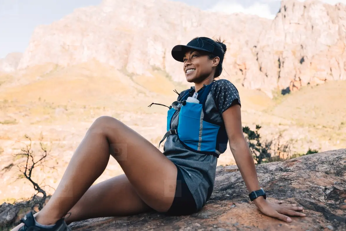 Cheerful Woman Relaxing During Trail Runner In Hiking