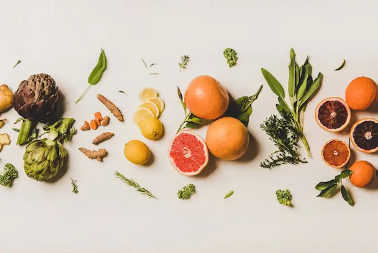 Variety of colorful immunity boosting plant foods over white background