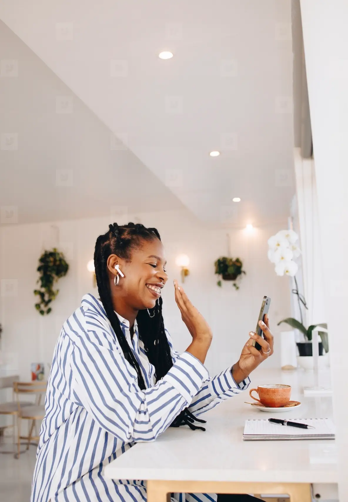 Happy Young Business Woman Waving On A Video Call While Working In A ...