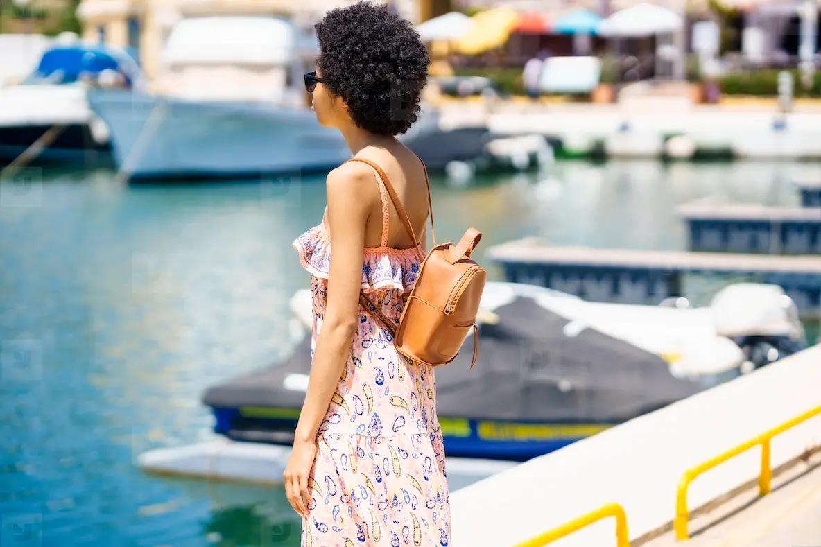 Black Woman Admiring Sea In Port Photo (270149) - YouWorkForThem