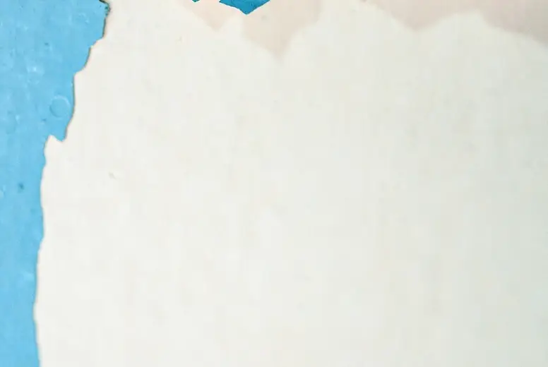Photography background of a grunge wall with cracked paint in bl