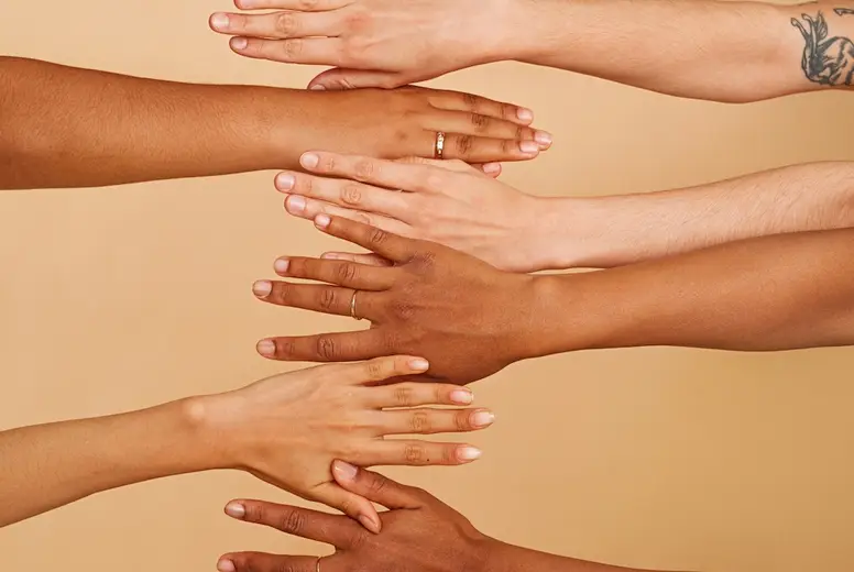 Hands of unrecognizable women with different skin colors