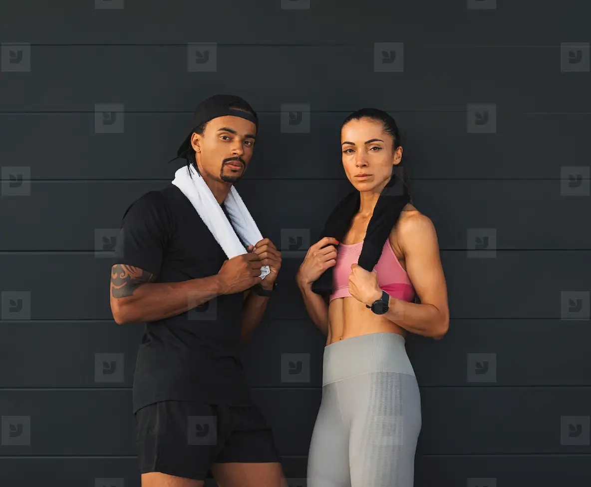 Woman And Man In Sports Clothes At A Black Two Athletes Of