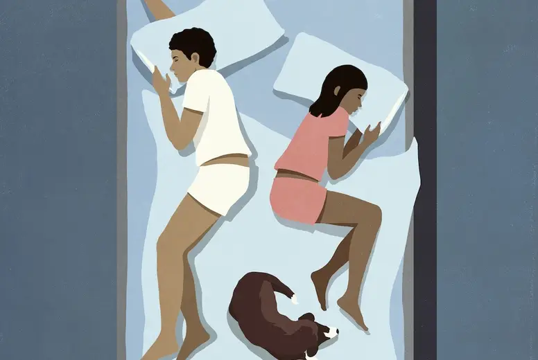 View from above couple sleeping in bed with dog