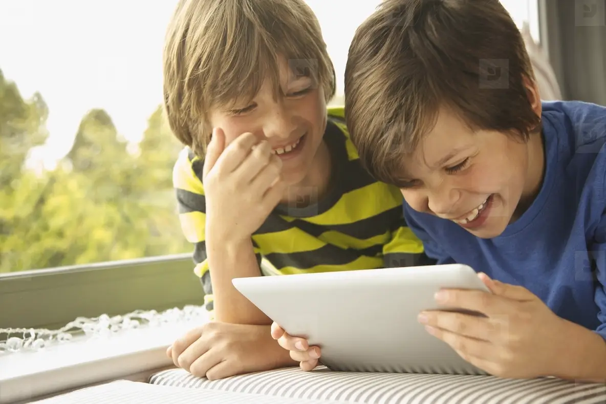 Boys Using Digital Tablet Smiling