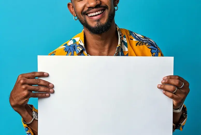 A smiling man holds a white blank sign in his hands
